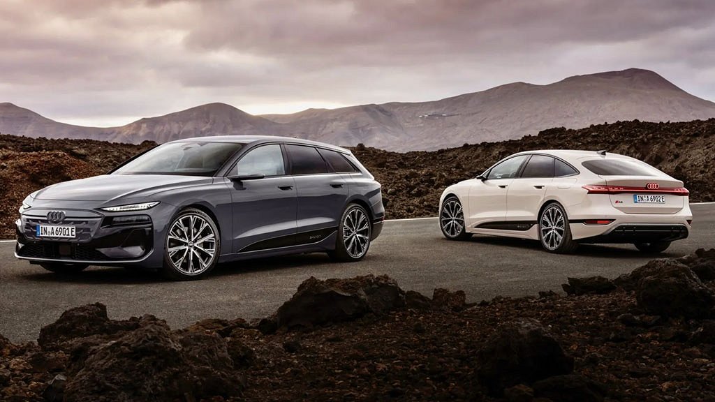 Två Audi A6 e-tron parkerade fram bergslandskap