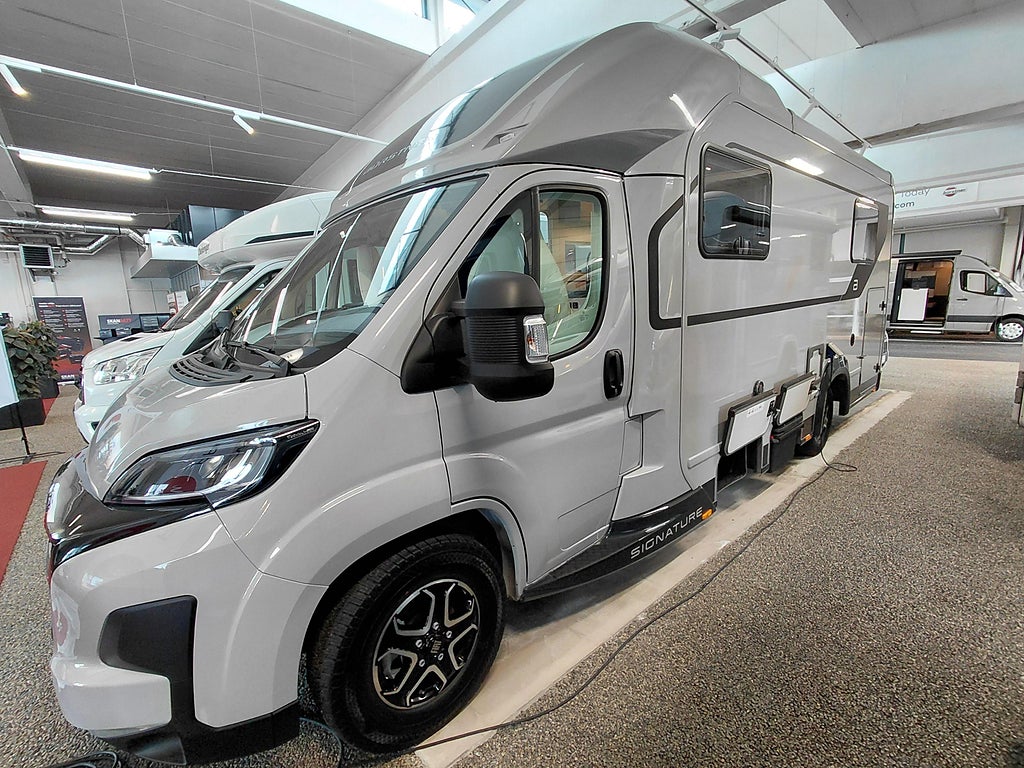 Bürstner Signature / SFT 7.5 (drop-down) 180 hk aut, stort garage med mer